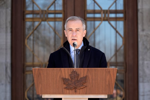 Prime Minister Mark Carney speaks to media at Rideau Hall, where he asked the Governor General to dissolve Parliament and call an election, in Ottawa, Sunday, March 23, 2025. THE CANADIAN PRESS/Adrian Wyld/The Canadian Press via AP) /The Canadian Press via AP)