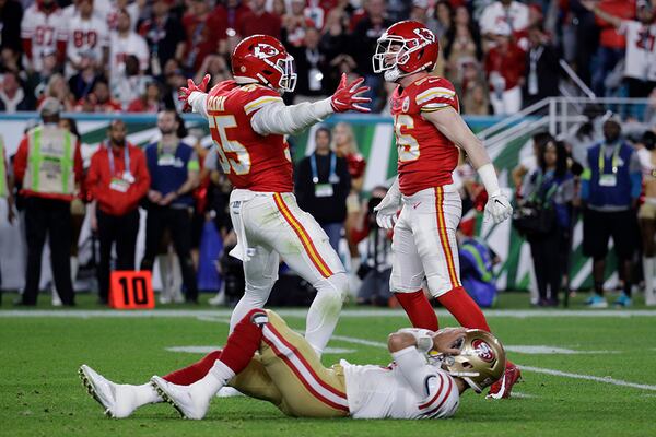 Kansas City Chiefs' Frank Clark (55) and Ben Niemann celebrate over San Francisco 49ers quarterback Jimmy Garoppolo during the second half of Super Bowl 54 Sunday, Feb. 2, 2020, in Miami Gardens, Fla.