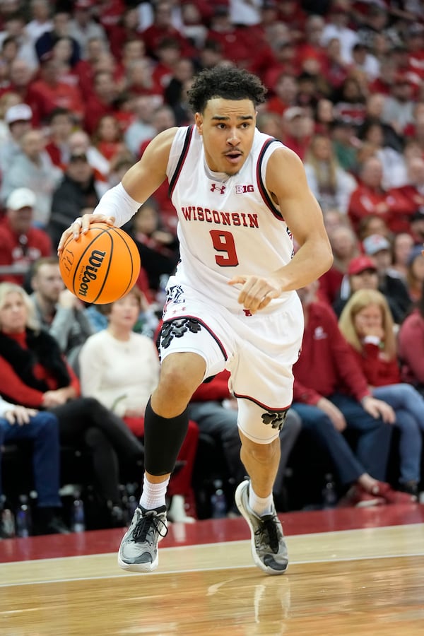 Wisconsin guard John Tonje (9) dribbles the ball against Oregon during the second half of an NCAA college basketball game Saturday, Feb. 22, 2025, in Madison, Wis. (AP Photo/Kayla Wolf)