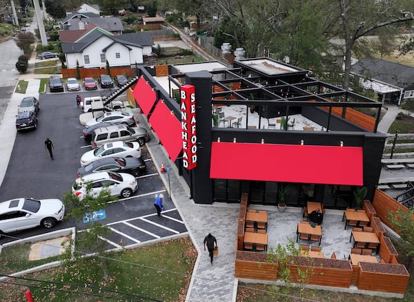 Bankhead Seafood's shiny new building sticks out considerably from neighbors like West Lake Food Mart convenience store, an aging A-Town Wings location and an empty parking lot across Donald Lee Hollowell. (Hyosub Shin/AJC)