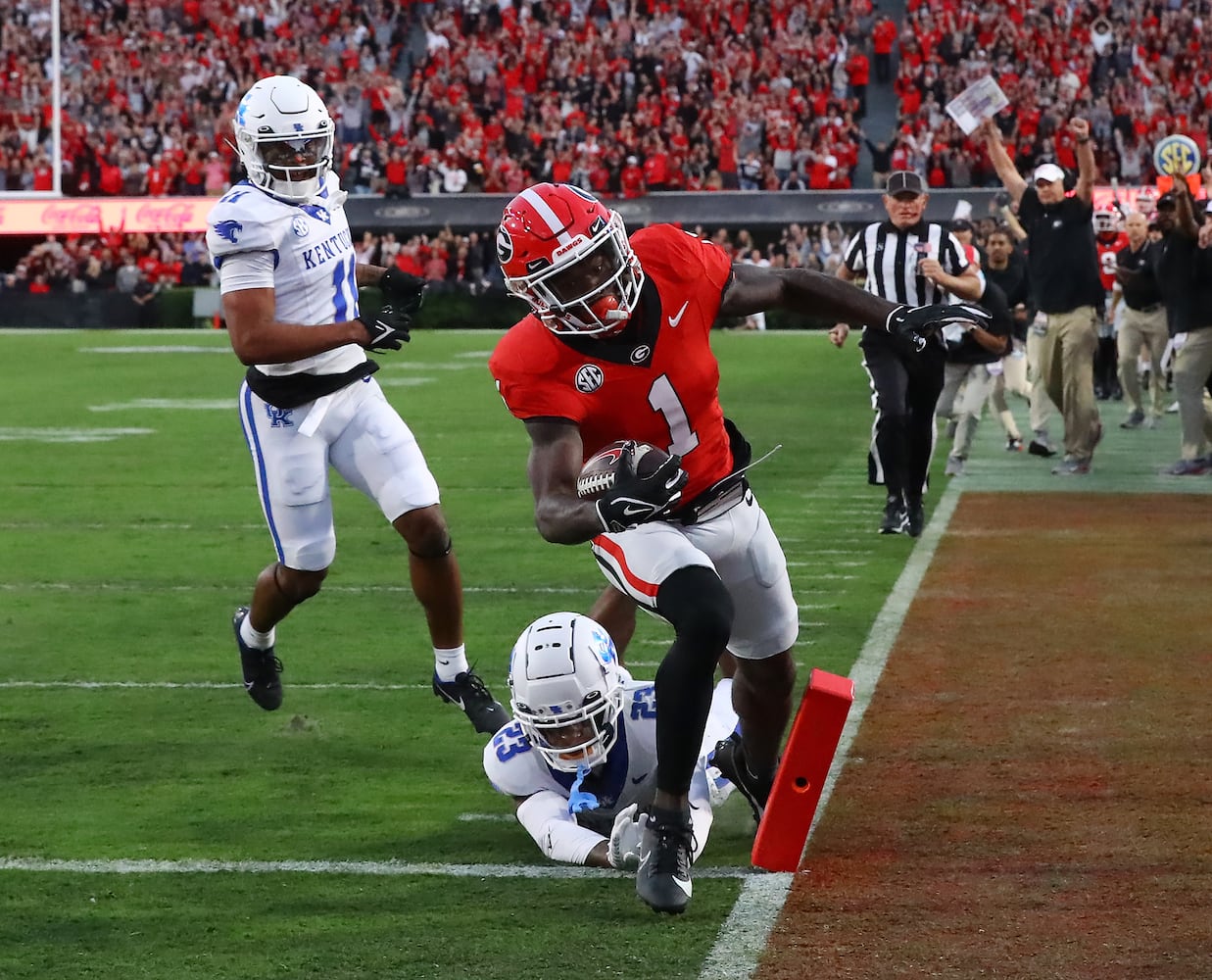 Georgia wide receiver Marcus Rosemy-Jacksaint gets in the end zone past defensive back Andru Phillips to take a 7-0 lead over Kentucky during the opening drive for a 7-0 lead during the first quarter.  Curtis Compton for the Atlanta Journal Constitution