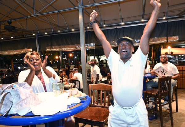 June 23, 2021 Atlanta - Atlanta Hawks fans Ezzell Williams (right) and Tameaka Hamilton (left) react as they watch Atlanta Hawks beating Milwaukee Bucks at Hudson Grille in downtown Atlanta on Wednesday, June 23, 2021. (Hyosub Shin / Hyosub.Shin@ajc.com)