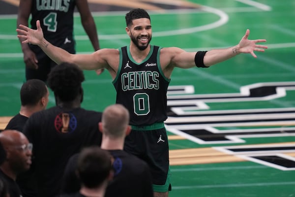 Boston Celtics forward Jayson Tatum (0) celebrates during the second half of an Emirates NBA Cup basketball game against the Cleveland Cavaliers, Tuesday, Nov. 19, 2024, in Boston. (AP Photo/Charles Krupa)