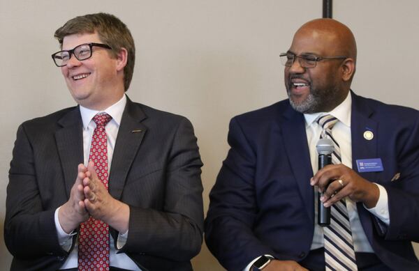 Jeff Parker, general manager and CEO, MARTA, left, and Chris Tomlinson, executive director, State Road & Tollway Authority (SRTA) and the Georgia Regional Transportation Authority (GRTA), laugh while answering questions related to the MARTA referendum, which would extend MARTA to Gwinnett County, at the Commerce Club in Atlanta, Georgia on Monday, March 11, 2019. EMILY HANEY / emily.haney@ajc.com