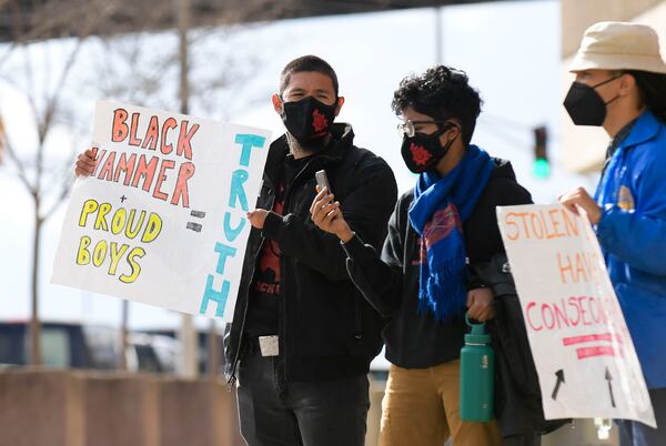 Representatives from the group Black Hammer protest Thursday, Jan. 6, 2022 at the CNN building in Atlanta. (Daniel Varnado/For the Atlanta Journal-Constitution)