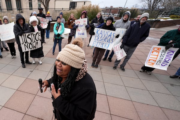 Laquanda Jacobs speaks at a rally outside the federal courthouse on what was to be the opening day of a trial for former police detective Roger Golubski, Monday, Dec. 2, 2024, in Topeka, Kan. (AP Photo/Charlie Riedel)