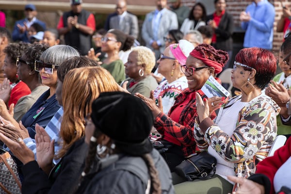 Older Atlanta residents who frequent the city's senior programs celebrate with officials as they break ground on the city's first senior center at John A. White Golf Course in southwest Atlanta.