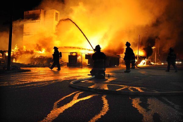 Baltimore firefighters battle a three-alarm fire April 27, 2015, at a senior-living facility under construction at Federal and Chester Streets in East Baltimore. It was unclear whether is was related to the ongoing riots but was one of several fires in the area.