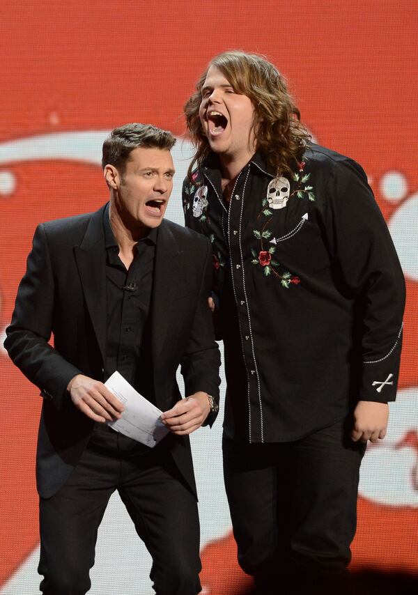 AMERICAN IDOL XIII: L-R: Ryan Seacrest and Caleb Johnson sing together on AMERICAN IDOL XIII airing Thursday, April 16 (8:00-10:00 PM ET / PT) on FOX. CR: Frank Micelotta / FOX. Copyright 2014 / FOX Broadcasting. AMERICAN IDOL XIII: L-R: Ryan Seacrest and Caleb Johnson sing together on AMERICAN IDOL XIII airing Thursday, April 16 (8:00-10:00 PM ET / PT) on FOX. CR: Frank Micelotta / FOX. Copyright 2014 / FOX Broadcasting.