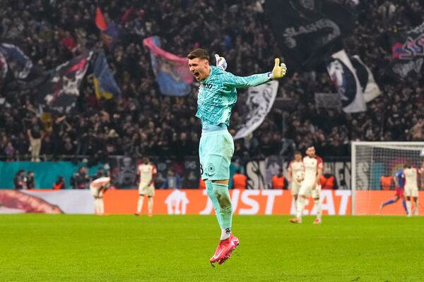 FCSB's goalkeeper Stefan Tarnovanu celebrates his team's first goal, scored by Alexandru Baluta, during the Europa League round of 16, first leg soccer match between FCSB and Lyon at the National Arena stadium, Thursday, March 6, 2025. (AP Photo/Andreea Alexandru)