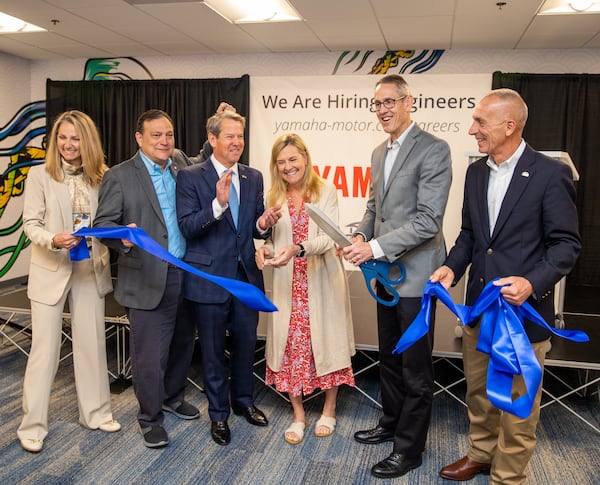 Kim Speciale, left, Ben Speciale, President of Yamaha US Marine Business Unit , Governor Brian Kemp, First Lady Marty Kemp, Mike Chrzanowski, Yamaha Motor Corporation’s US President, and Kennesaw Mayor Derek Easterling celebrate the official grand opening of the new Yamaha Marine Innovation Center in Kennesaw on Wednesday, April 12, 2023.  The facility is dedicated to creating the next generation in outdoor sport connected technology and is specifically recruiting local university students for engineering and technical jobs.  (Jenni Girtman for The Atlanta Journal-Constitution)