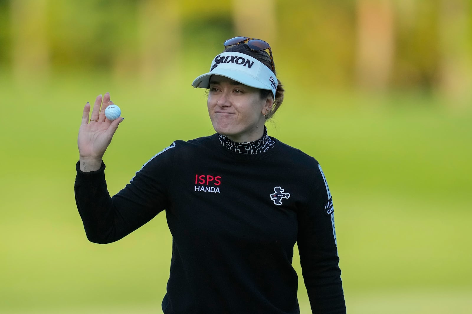 Hannah Green of Australia celebrates on the 18th hole after winning the LPGA Ladies Championship golf tournament at the Seowon Valley Country Club in Paju, South Korea, Sunday, Oct. 20, 2024. (AP Photo/Lee Jin-man)