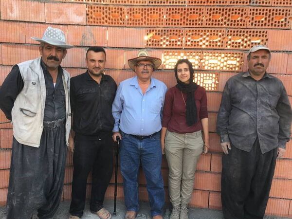 Soleen Karim (second from the right) is a U.S. citizen and former refugee who is now an architectural designer living in Gwinnett County. She has a non-profit that built in a refugee camp in Iraq, where this photo was taken. An ethnic Kurd, Karim said she worries that another generation of Kurdish children will be displaced by war after the U.S. withdrew forces from northern Syria, leaving Kurds there open for attack by Turkish troops. SPECIAL