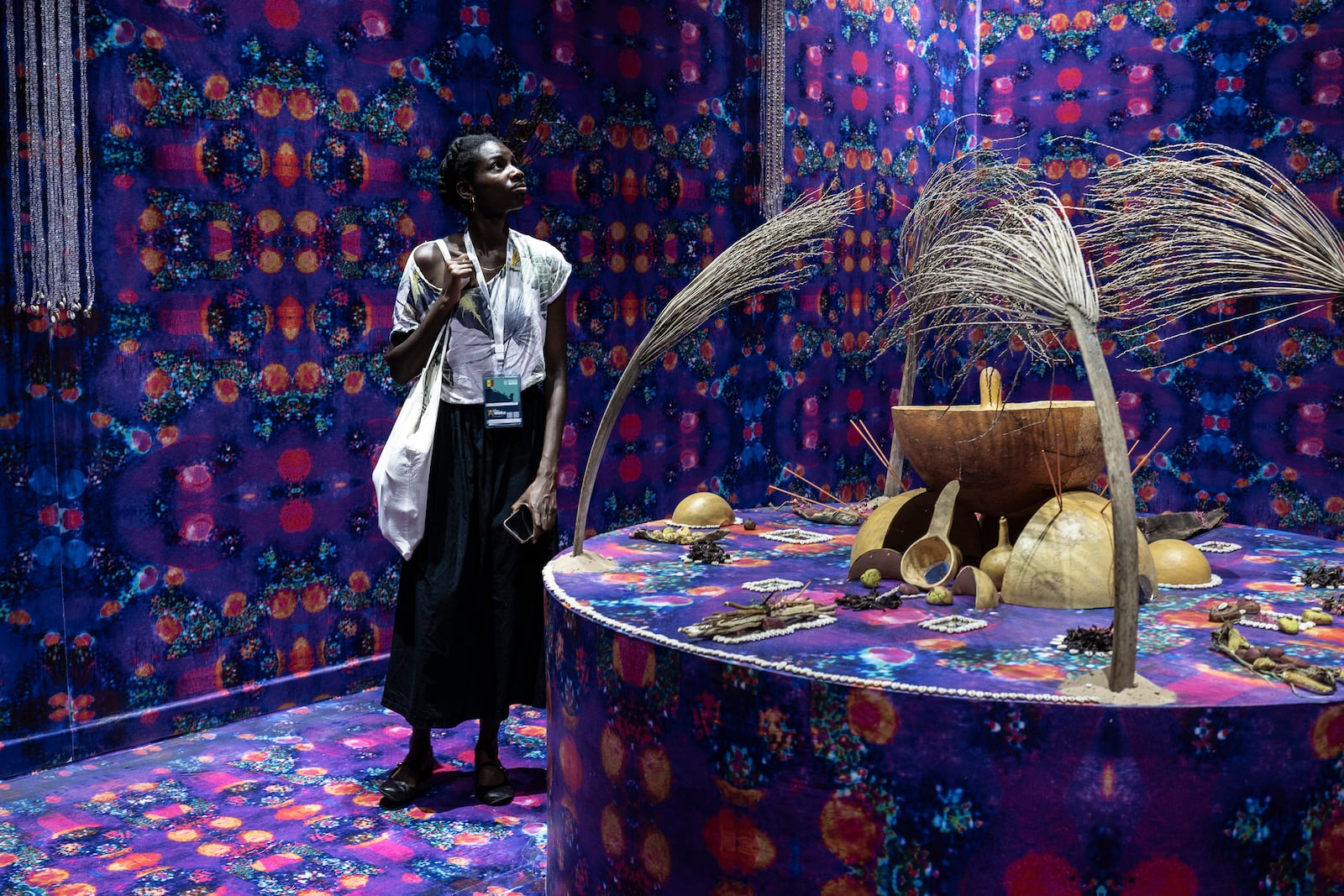 A visitor explores the international exhibit at the Dakar Biennale of Contemporary African Art in Dakar, Senegal, Friday, Nov. 8, 2024. (AP Photo/Annika Hammerschlag)