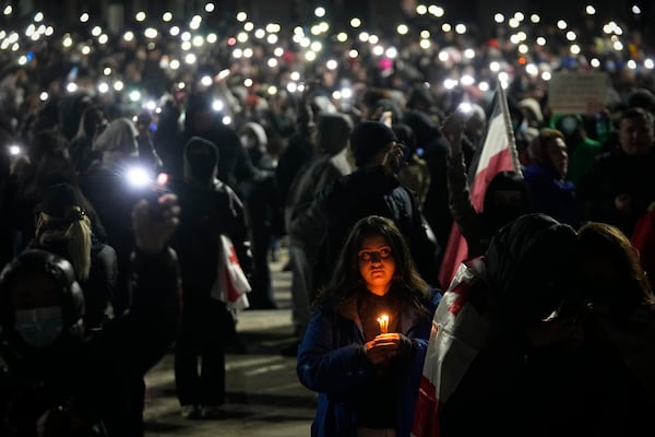 Demonstrators gather to protest against the government's decision to suspend negotiations on joining the European Union, in Tbilisi, Georgia, on Wednesday, Dec. 4, 2024. (AP Photo/Pavel Bednyakov)