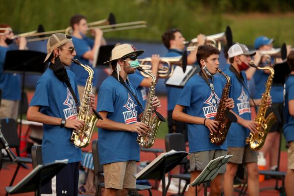 The Walton High School marching band performs in the end zone during a home football game against Kell in Marietta, Georgia on Sept. 4, 2020. JASON GETZ FOR THE ATLANTA JOURNAL-CONSTITUTION