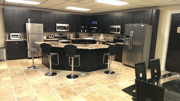 The listing boasts a modernized commercial kitchen.