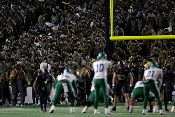 Army cadets yell as Tulane quarterback Darian Mensah (10) waits for the ball during the second half of the American Athletic Conference championship NCAA college football game Friday, Dec. 6, 2024, in West Point, N.Y. Army won 35-14. (AP Photo/Adam Hunger)