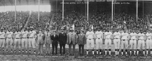 Group portrait of players from the Monarchs and the Hilldale baseball teams in front of grandstands filled with spectators before the opening game of the 1924 Negro Leagues World Series on Oct. 11 in Kansas City, Mo. (J.E. Miller / Library of Congress)