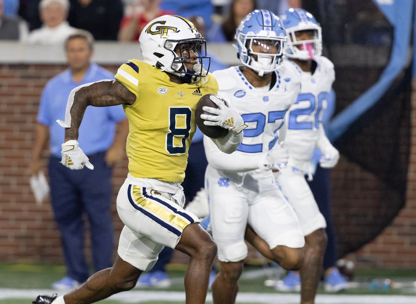 Georgia Tech Yellow Jackets wide receiver Malik Rutherford (8) runs 42 yards with a Haynes King pass to score a touchdown during the second quarter.  (Bob Andres for the Atlanta Journal Constitution)