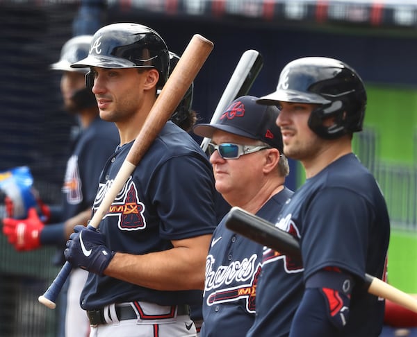 031622 North Port: Atlanta Braves first baseman Matt Olson (from left), hitting coach Kevin Seitzer, and third baseman Austin Riley watch pitcher Dylan Lee throw live batting practice during Spring Training at CoolToday Park on Wednesday, March 16, 2022, in North Port.    “Curtis Compton / Curtis.Compton@ajc.com”