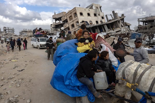 
                        Displaced Palestinians flee with their belongings after the Israeli government issued warnings to evacuate their homes, in Gaza City on Thursday, March 20, 2025. Prime Minister Benjamin Netanyahu of Israel and President Donald Trump have been mirroring each other as they go to war with their own governments, according to a New York Times analysis. (Saher Alghorra/The New York Times)
                      