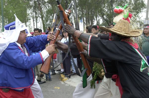 Mexicans celebrate Cinco de Mayo with a reenactment of the 1862 battle between the French and the Zacapuaxtlas Indians May 5, 2001 in Puebla, Mexico.