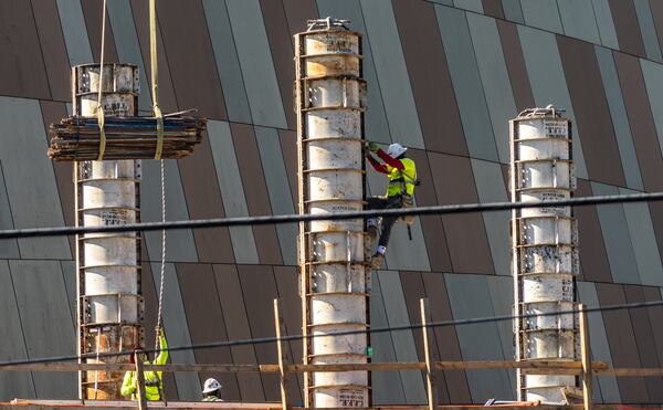 Construction workers continue work on a balmy Tuesday, Aug. 13, 2024 at the National Center for Civil and Human Rights located at 100 Ivan Allen Jr. Blvd in Atlanta. The center is adding a two-wing, 24,000-square-foot expansion that will include updates to the permanent civil and human rights exhibits and a gallery to display the artifacts and papers of Dr. Martin Luther King and more. Weather In the city was in the lower 90’s. Similar conditions are in store for Wednesday and Thursday. On Friday there is a 30% chance of rain with isolated evening showers. (John Spink/AJC)