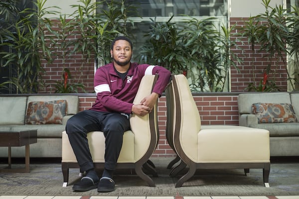 Morehouse College Cinema, Television and Emerging Media Studies (CTEMS) senior Daquan Spratley sits in the lobby of his temporary residence at the Embassy Suites Hotel in downtown Atlanta, Thursday, April 16, 2020. Spratley’s hometown is Pittsburgh and he is not able to travel home during the COVID-19 pandemic. He says he was using the gym at the hotel but has had to find an alternative way to exercise after the hotel closed the facility. (ALYSSA POINTER / ALYSSA.POINTER@AJC.COM)