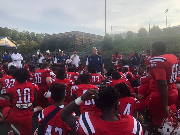 Sandy Creek coach Brett Garvin speaks to his team after the 38-27 win over Newnan in the 2022 Fayetta-Coweta Kickoff Classic.