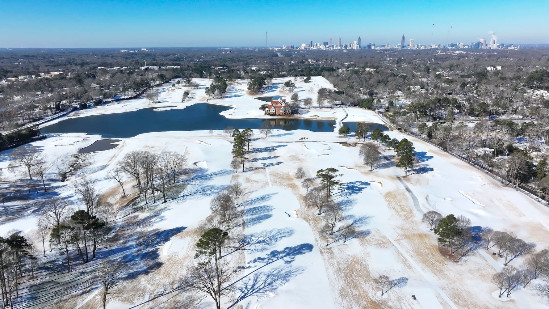 In this aerial image, the East Lake golf course is blanketed in snow a day after a winter storm struck Metro Atlanta. Authorities advised residents to stay home due to icy road conditions on Wednesday, January 22, 2025,
(Miguel Martinez/ AJC)