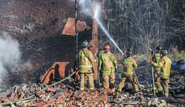 Atlanta firefighters were on the scene of a blaze at two vacant apartment buildings near Donald Lee Hollowell Parkway.