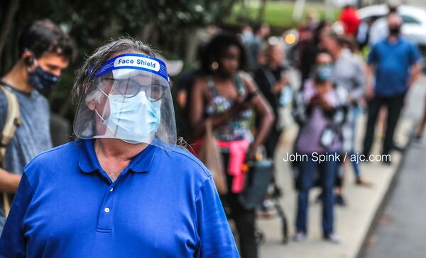 Voters line up outside Park Tavern in Midtown Atlanta to vote in Georgia's primary on Tuesday, June, 9, 2020. Long waits were expected. JOHN SPINK / JOHN.SPINK@AJC.COM