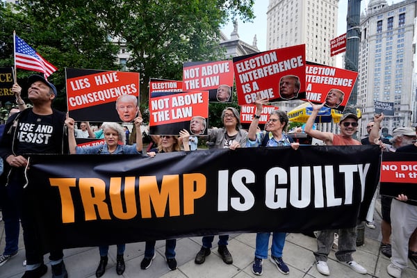 Anti-Trump demonstrators celebrate his 34 felony convictions near Manhattan Criminal Court on Thursday.