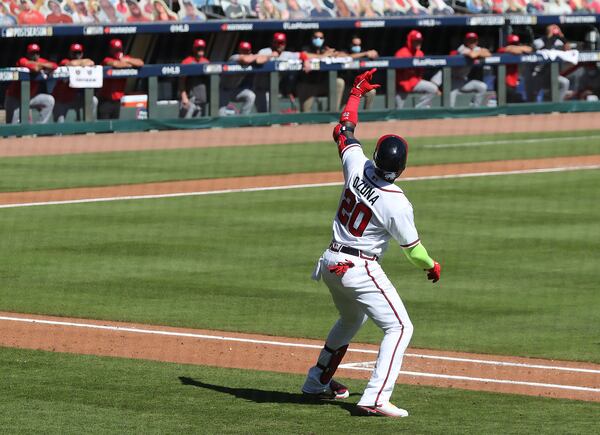 Braves designated hitter Marcell Ozuna stops on the base path to celebrate hitting a two-run homer during the 8th inning of Game 2 of the National League wild card playoff series against the Cincinnati Reds Thursday, Oct 1, 2020, at Truist Park in Atlanta. (Curtis Compton / Curtis.Compton@ajc.com)