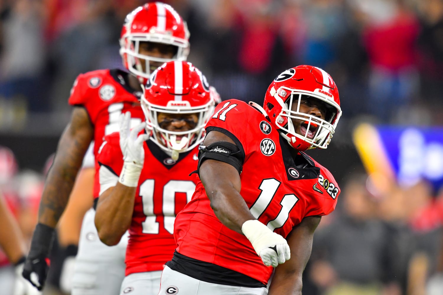 Georgia Bulldogs linebacker Jalon Walker (11) reacts as linebacker Jamon Dumas-Johnson (10) looks on after sacking TCU Horned Frogs quarterback Max Duggan during the second half of the College Football Playoff National Championship at SoFi Stadium in Los Angeles on Monday, January 9, 2023. Georgia won 65-7 and secured a back-to-back championship. (Hyosub Shin / Hyosub.Shin@ajc.com)