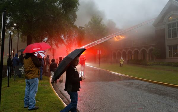 Firefighters work to control a three-alarm fire in the attic space in Moody Music Hall on the campus of the University of Alabama.