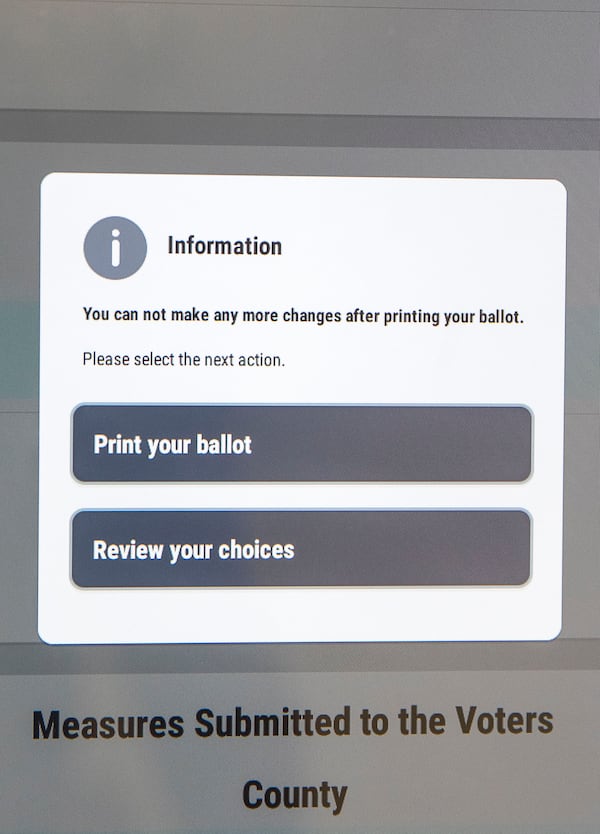 09/16/2019 -- Atlanta, Georgia --An informative box is displayed ballot making box before a voter can print their ballot at the James H. "Sloppy" Floyd building in Atlanta, Monday, September 16, 2019.  Chris Harvey, director of elections division for the Georgia Secretary of State, and Scott Tucker, customer relations manger for Dominion Voting, gave a demonstration of the new Georgia voting machines. (Alyssa Pointer/alyssa.pointer@ajc.com)