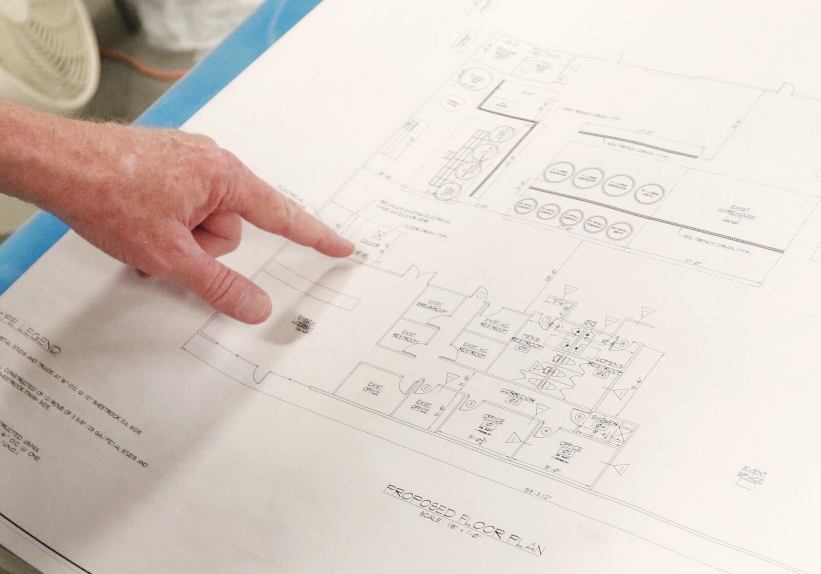 4/19/19 - Suwanee - Wayne Baxter, founder and brewmaster of Monkey Wrench Brewing, points at the floor plan for their new building space at Monkey Wrench Brewing in Suwanee, Georgia on Wednesday, April 17, 2019. EMILY HANEY / emily.haney@ajc.com