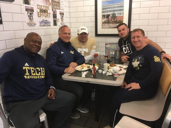 Former Georgia coach Mark Richt (second from left) at lunch at a Waffle House in Midtown Atlanta on March 20, 2020. From left: Tech character-development coach Derrick Moore; Richt; Tech coach Geoff Collins; Richt's son, Jon Richt; Tech strength-and-conditioning coach Lewis Caralla. (AJC photo by Ken Sugiura)