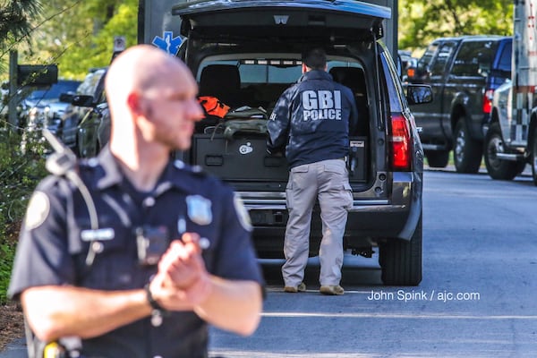 GBI officials arrived on the scene at the end of a standoff between a barricaded gunman and Atlanta police. JOHN SPINK / JSPINK@AJC.COM