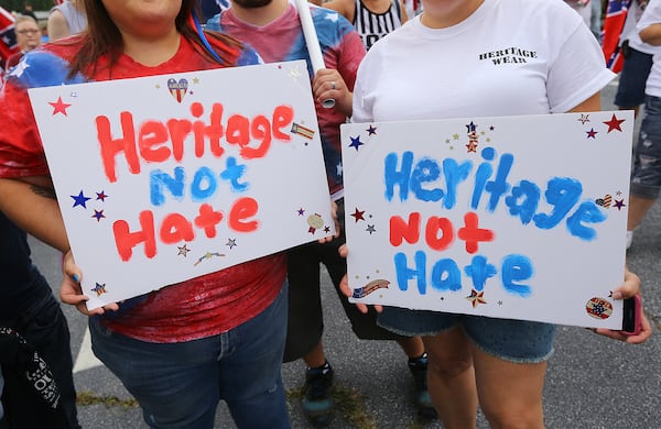 080215 STONE MOUNTAIN: Brittany Underwood (left) and Charlotte Holland hold signs during a pro-Confederate flag rally at Stone Mountain Park on Saturday, August 1, 2015, in Stone Mountain. Curtis Compton / ccompton@ajc.com