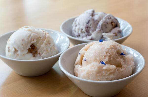 A trio of flavors at Queen of Cream: (from left, clockwise) Peach with Amaretti Cookies, Blueberry Cobbler and cantaloupe and lemon verbena sorbet. CONTRIBUTED BY HENRI HOLLIS