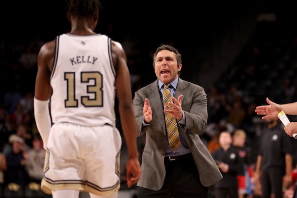 Georgia Tech Yellow Jackets head coach Josh Pastner talks with guard Miles Kelly (13) after a play during the second half against the Northern Illinois Huskies in a NCAA men’s basketball game at McCamish Pavilion, Thursday, November 17, 2022, in Atlanta. Georgia Tech won 68-50. Jason Getz / Jason.Getz@ajc.com)