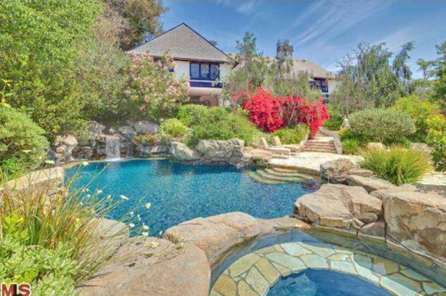 Property includes Mediterranean-style home, lagoon pool