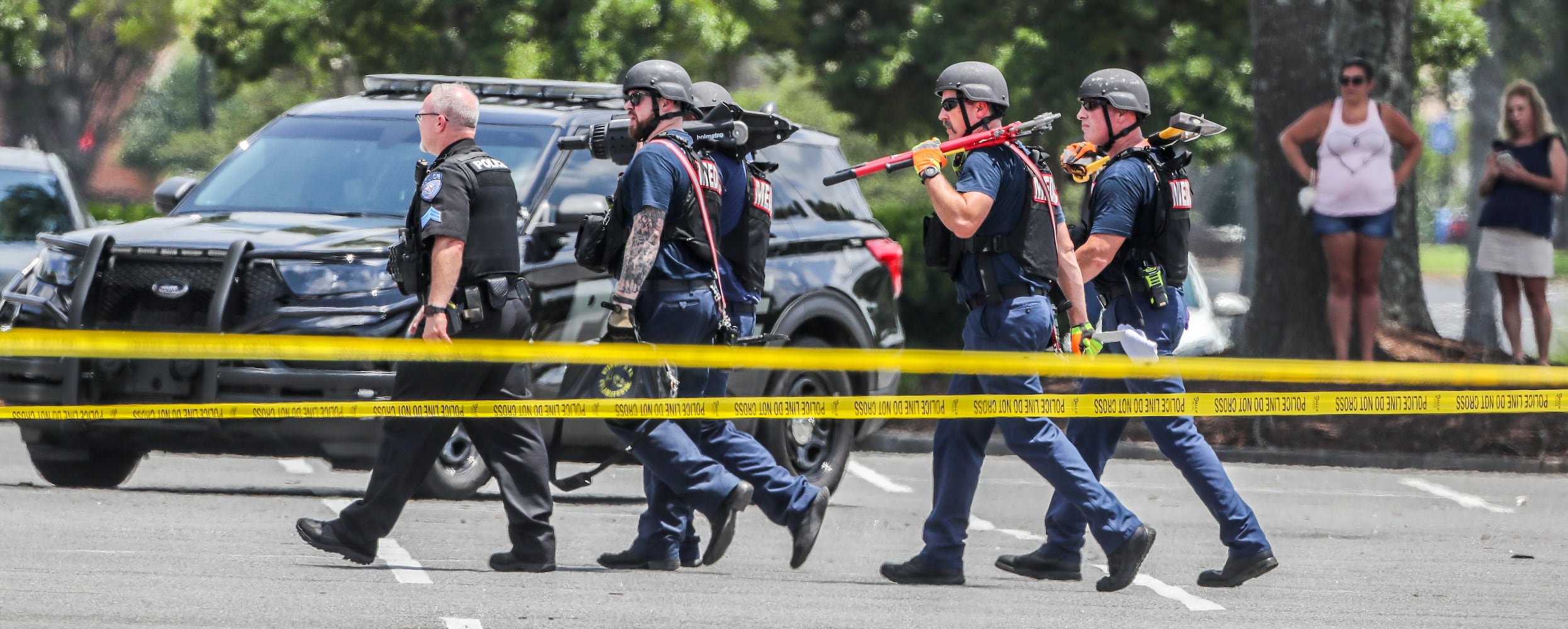 June 14, 2022 Alpharetta: An armed man who was barricaded inside a HomeGoods store in Alpharetta was taken into custody Tuesday June 14, 2022 after a standoff with SWAT. The man allegedly brandished a gun and made threats, prompting evacuations at the store and nearby businesses on North Point Parkway just south of North Point Mall, according to Alpharetta police. He was led out of the building in handcuffs and a medical mask shortly before 1:30 p.m. His name and charges were not released. No shots were fired and no one was reported injured, but REI and Michaels were evacuated as police, fire and SWAT teams made camp in the shopping centerÕs parking lot. ÒWe do have the active scene contained,Ó Alpharetta police Lt. Andrew Splawn told reporters from the scene. ÒIf the public does have a reason to come to Alpharetta, the mall area, they are free to do so, but we do ask them to stay away from HomeGoods and the caution tape area that is defined as the perimeter.Ó
Store employees told Channel 2 Action News that chaos ensued when a voice came over the store loudspeaker telling everyone to ÒrunÓ and Òget out.Ó According to Channel 2, the gunman is a disgruntled former employee. ÒThe manager came out of the office and she just told us, all of us, to run,Ó an unnamed employee told the news station. ÒThe store was open, there was customers in the store, and we ran.Ó Police arrived on scene within two minutes of the first 911 call, Splawn said. He could not confirm if the armed man was connected to the store. It was not a hostage situation, according to Splawn. ÒThere were people taking cover to barricade themselves for safety, but as police officers were sweeping and searching the building, we were able to get everyone out safely,Ó he said. (John Spink / John.Spink@ajc.com)


