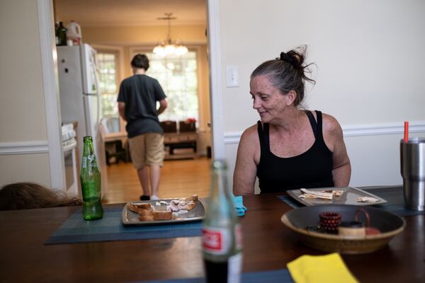 Alicia Hornsby eats lunch with her two children at their Canton home. Ben Gray for the Atlanta Journal-Constitution