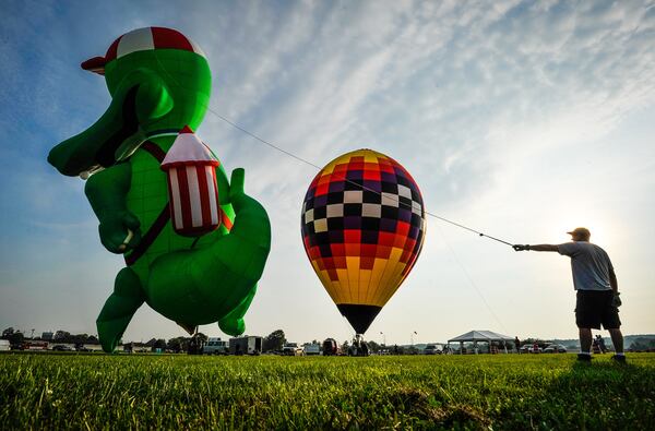 Sean Askren's hot air balloon "Bohica" and Doug Grimes' "The Gator" balloon were inflated during a media preview Thursday, July 20 for The Ohio Challenge Hot Air Balloon Festival at Smith Park in Middletown. The event runs Friday through Sunday. For more information visit www.ohiochallenge.com. NICK GRAHAM/STAFF