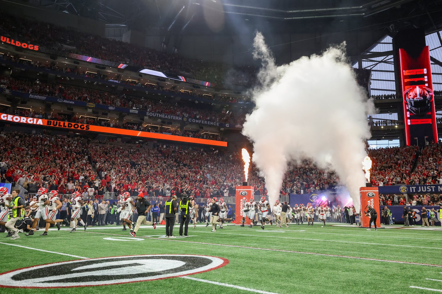 The Georgia Bulldogs enter the field to face the Alabama Crimson Tide in the SEC Championship football game at the Mercedes-Benz Stadium in Atlanta, on Saturday, December 2, 2023. (Jason Getz / Jason.Getz@ajc.com)