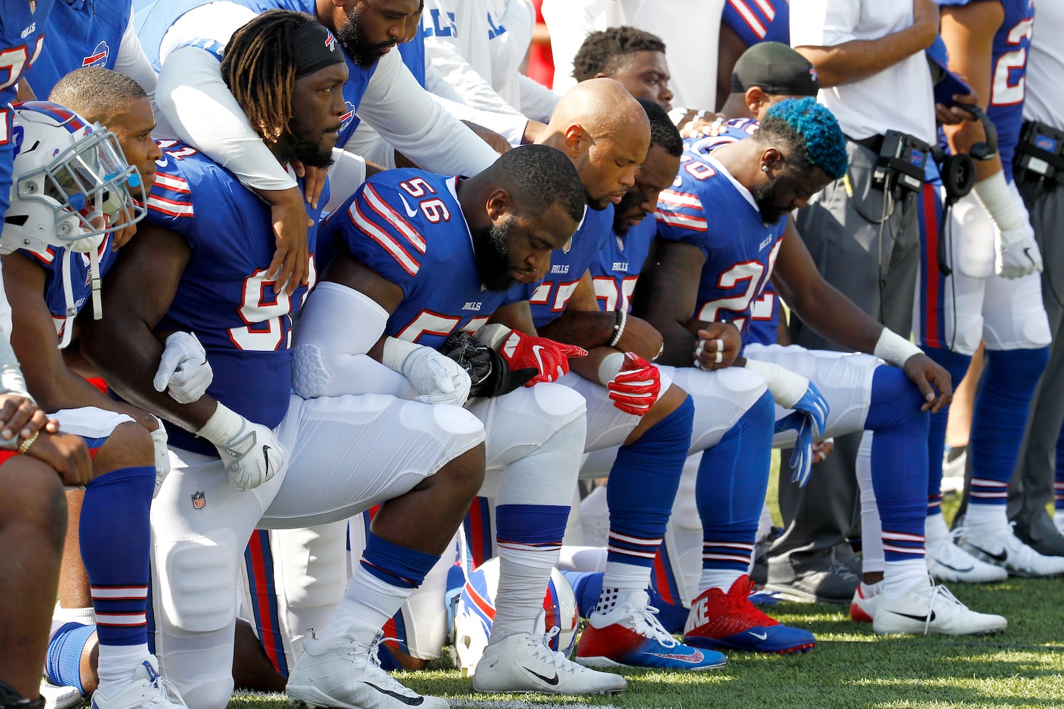 Photos: Falcons show solidarity during National Anthem